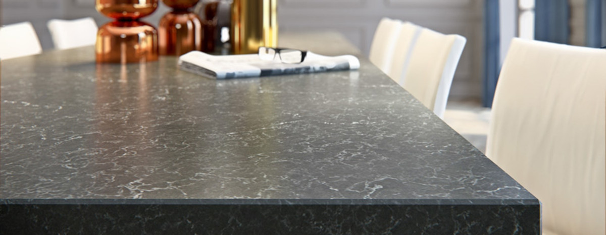 kitchen table showing the design from Caesarstone Piatra Grey at Pacific Shore Stones