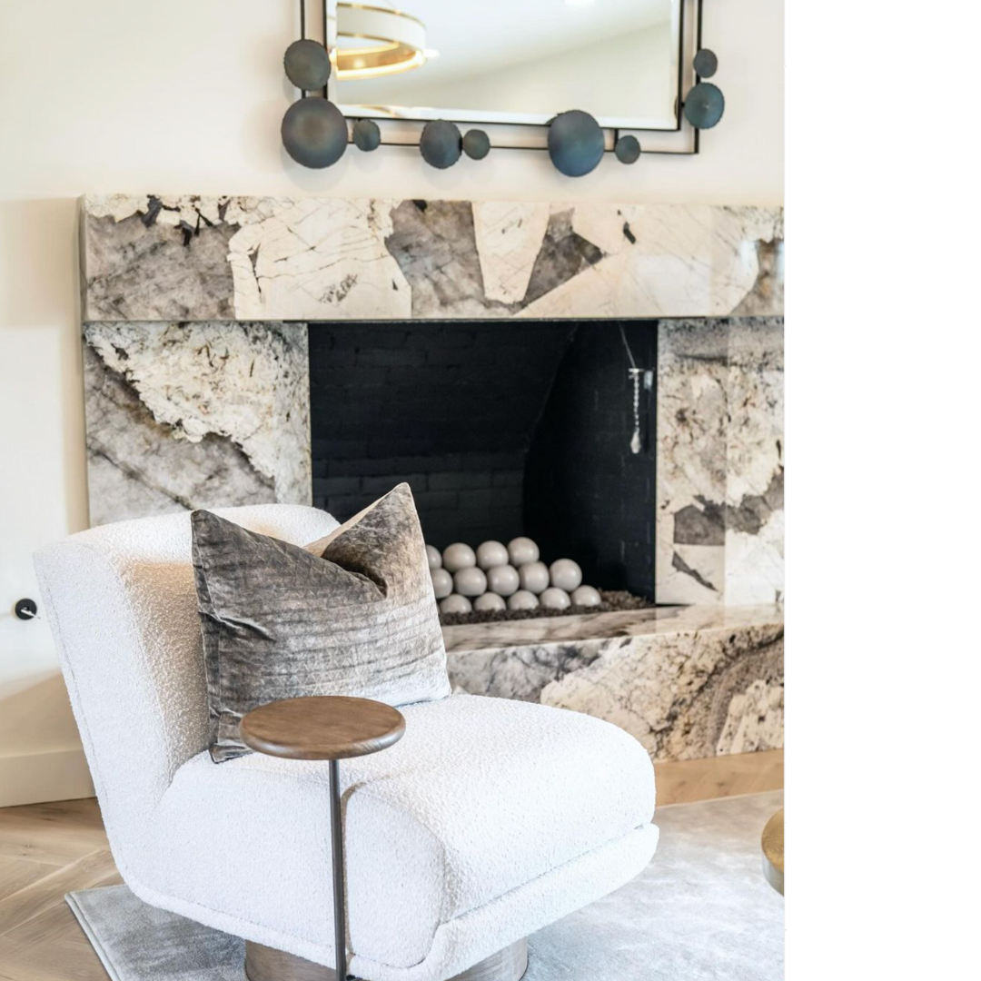 A close-up of a modern fireplace mantel constructed from a unique, boldly patterned white, grey, and brown stone, likely Patagonia granite or quartzite.