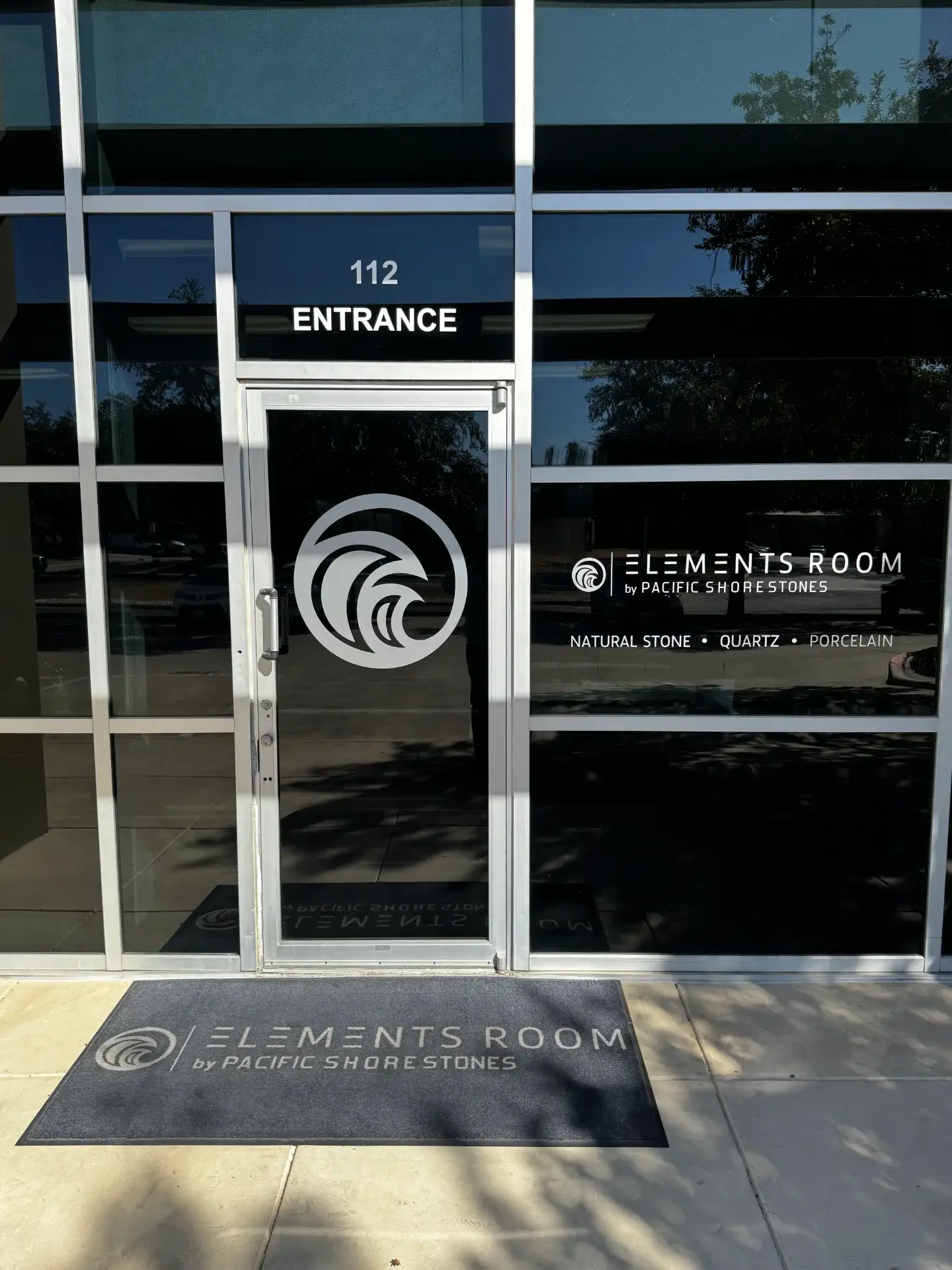 Entrance to Elements Room by Pacific Shore Stones, featuring natural stone, quartz, and porcelain.