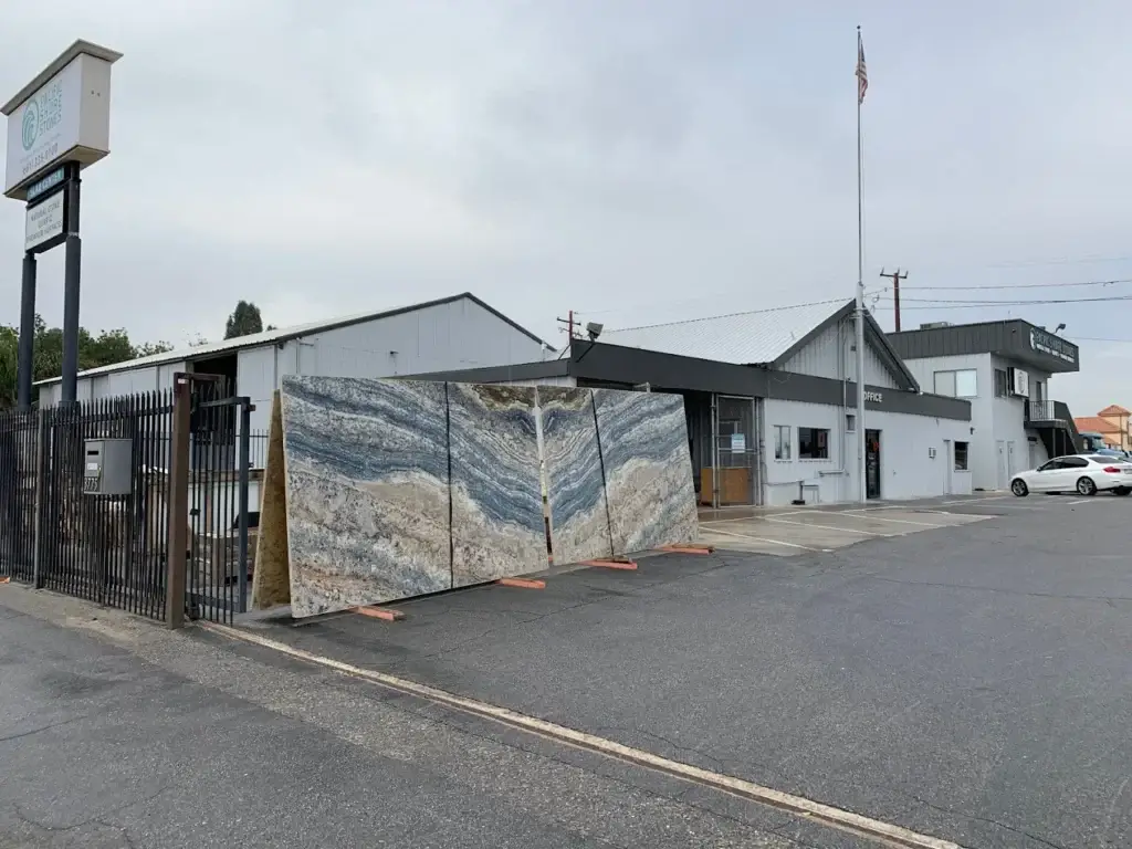 Exterior of Pacific Shore Stones facility with decorative stone panel facade in Bakersfield