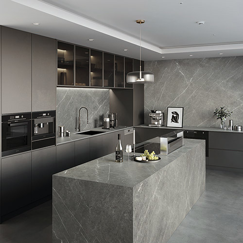 Modern kitchen with gray Pietra marble countertops, backsplash, and island. Dark cabinets and built-in appliances.