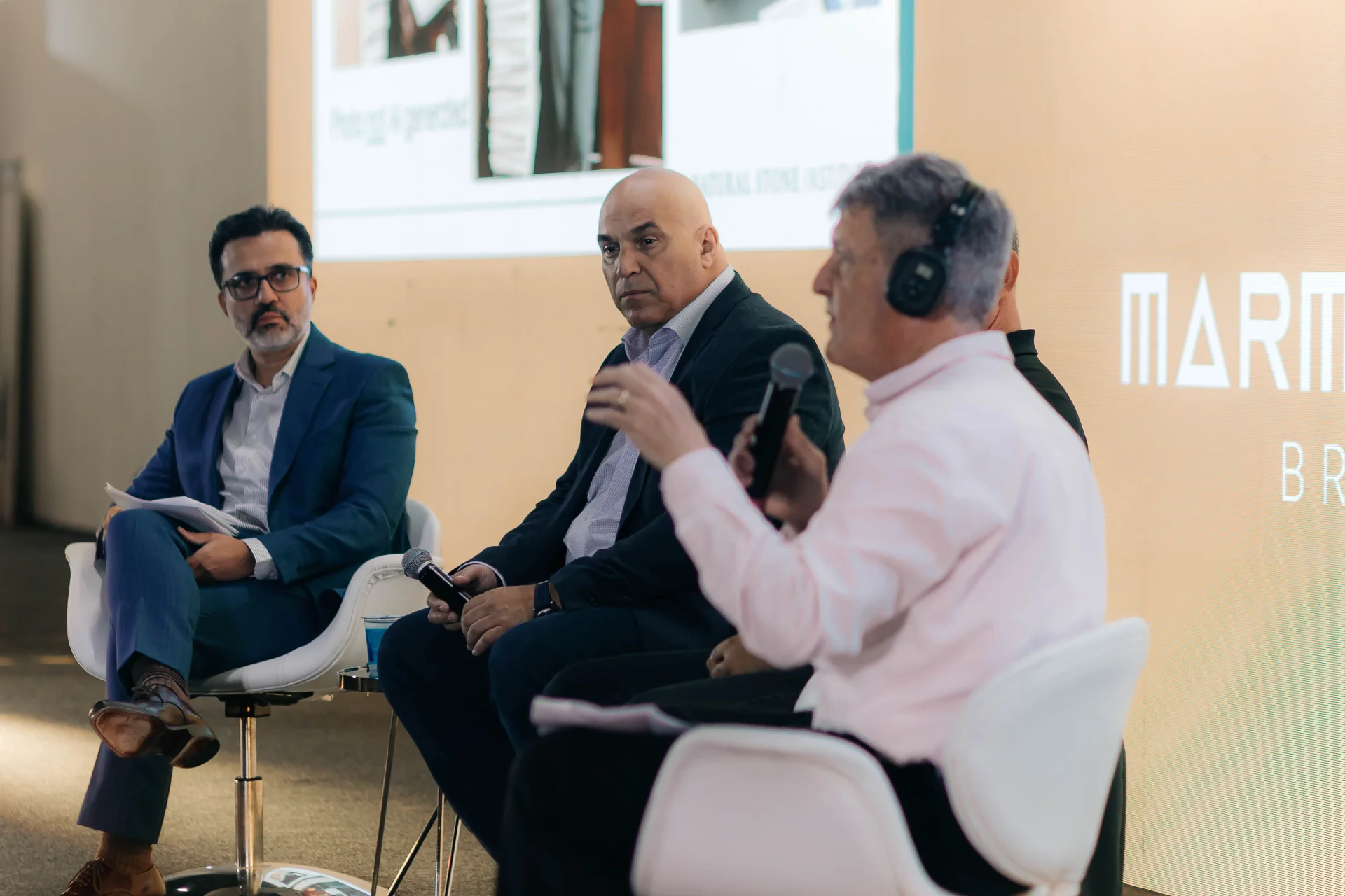 men-speaking-conference-panel