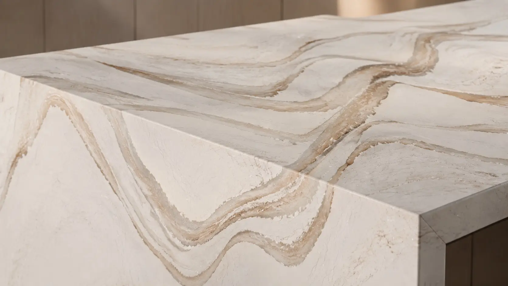 Close-up of a Cambria Brittanicca Gold Warm kitchen island with sweeping beige and caramel veining.