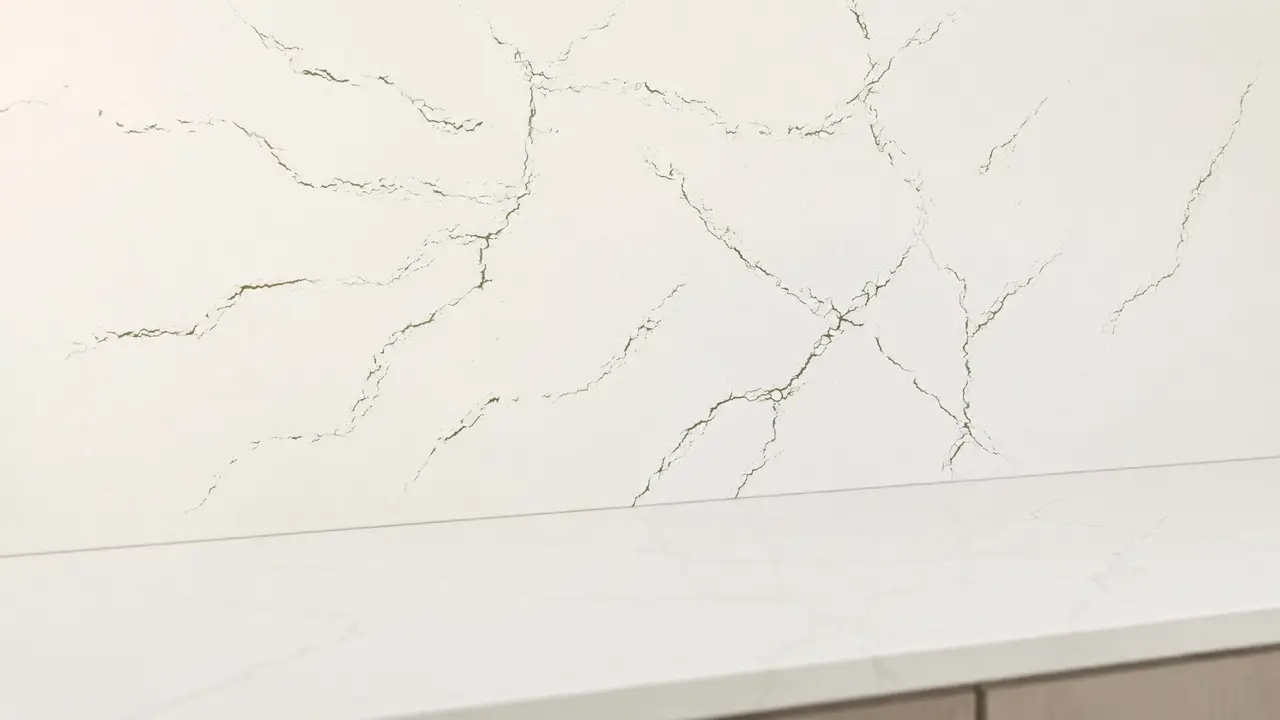 Cambria Berkshire quartz countertop and backsplash with delicate olive-green branching veins.