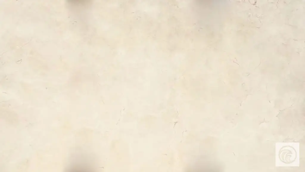 Crema Marfil marble slab with a creamy beige background and subtle natural veining
