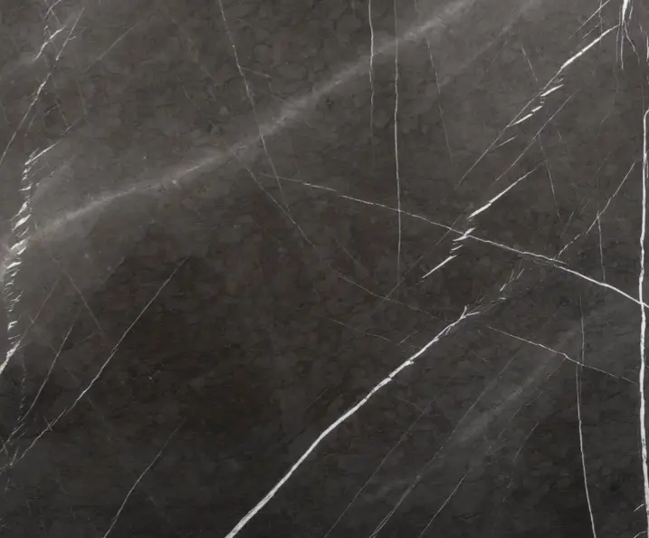 Pietra Grey marble slab with a dark charcoal background and thin white veins